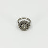 Front view of vintage platinum 2.70ct diamond cluster ring with old cut centre and geometric surround.