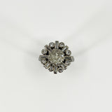 Front view of vintage platinum 2.70ct diamond cluster ring with old cut centre and alternating diamond surround.