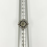 Vintage platinum 2.70ct diamond cluster ring shown front-on on a ring mandrel at UK Size K.