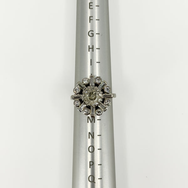 Vintage platinum 2.70ct diamond cluster ring shown front-on on a ring mandrel at UK Size K.