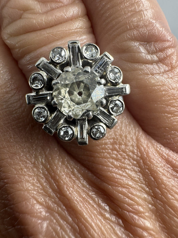 Vintage platinum 2.70ct diamond cluster ring worn on the hand, showing the scale of the 17mm cluster.