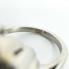 Close-up of the PLAT stamp inside the band of the vintage platinum diamond cluster ring.