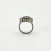 Rear profile of vintage platinum diamond cluster ring showing the raised setting and plain band.