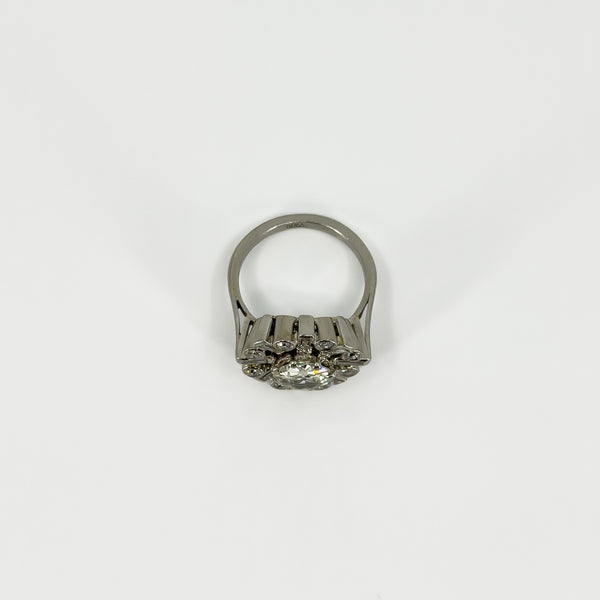 Rear view of vintage platinum diamond cluster ring showing the gallery, band and raised cluster setting.