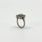 Rear view of vintage platinum diamond cluster ring showing the elevated setting and open gallery.