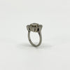 Rear view of vintage platinum diamond cluster ring showing the elevated setting and open gallery.
