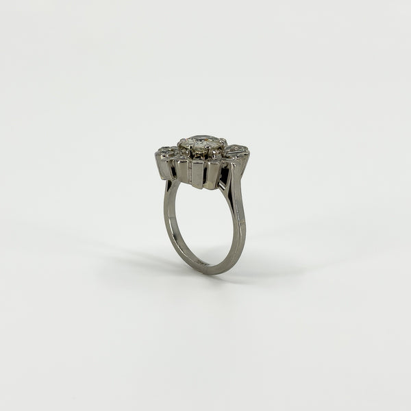 Rear view of vintage platinum diamond cluster ring showing the elevated setting and open gallery.