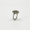 Side profile of vintage platinum diamond cluster ring showing the elevated cluster setting and platinum band.