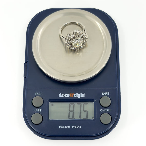 Vintage platinum 2.70ct diamond cluster ring weighing approximately 8.75g on digital scales.