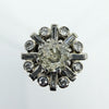 Close-up of vintage platinum cluster ring with 1.50ct estimated old cut centre and surrounding diamonds.