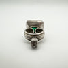 Side view of vintage silver pendant showing scrolled fob-style design