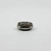 Side view of vintage sterling silver Virgin Mary photo locket showing the hinge and rounded case.