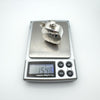 Digital scale displaying weight of sterling silver perfume pendant as 15.4 grams