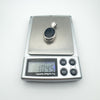Vintage sterling silver agate pendant on digital scale showing 10.45g weight
