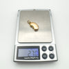 Digital scale showing the locket pendant weighs approximately 2.7g