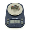 Sterling silver giardinetti brooch on digital scales showing approx. 6.50g weight with multicoloured paste stones.