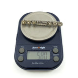 Antique sterling silver paste and pearl bar brooch on scales showing approx 5.80g.