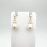 Front view of white pearl and CZ drop earrings in sterling silver 925