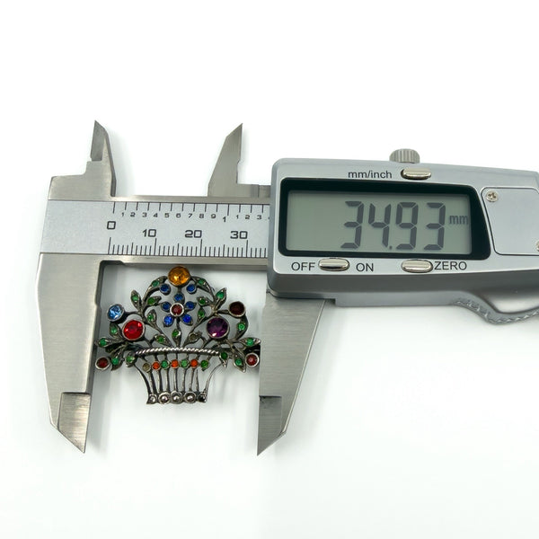 Calipers showing approx. 34.93mm width of the sterling silver giardinetti floral basket brooch.