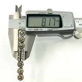 Digital calipers showing the brooch width at approximately 8.17mm.