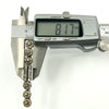 Digital calipers showing the brooch width at approximately 8.17mm.