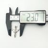 Width of vintage aircraft pendant shown as 23.0mm using digital calipers