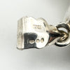 Ultra close-up of hallmarks including 925, London import mark, and date letter ‘u’