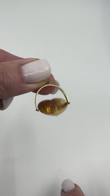 Video of vintage 9ct gold spinning fob pendant rotating to reveal the words I LOVE YOU on the centre disc