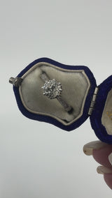 Antique platinum old cut diamond solitaire ring shown worn on the hand