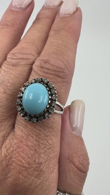 Video showing large turquoise and diamond sterling silver ring on finger