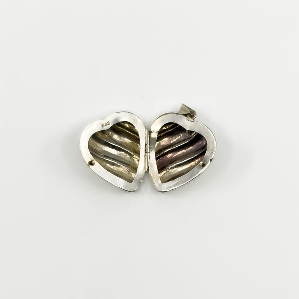 Inside view of the vintage sterling silver puffy heart photo locket with 925 stamp.